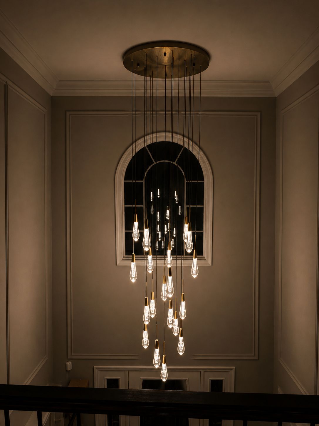 Statement pendant chandelier illuminated at night