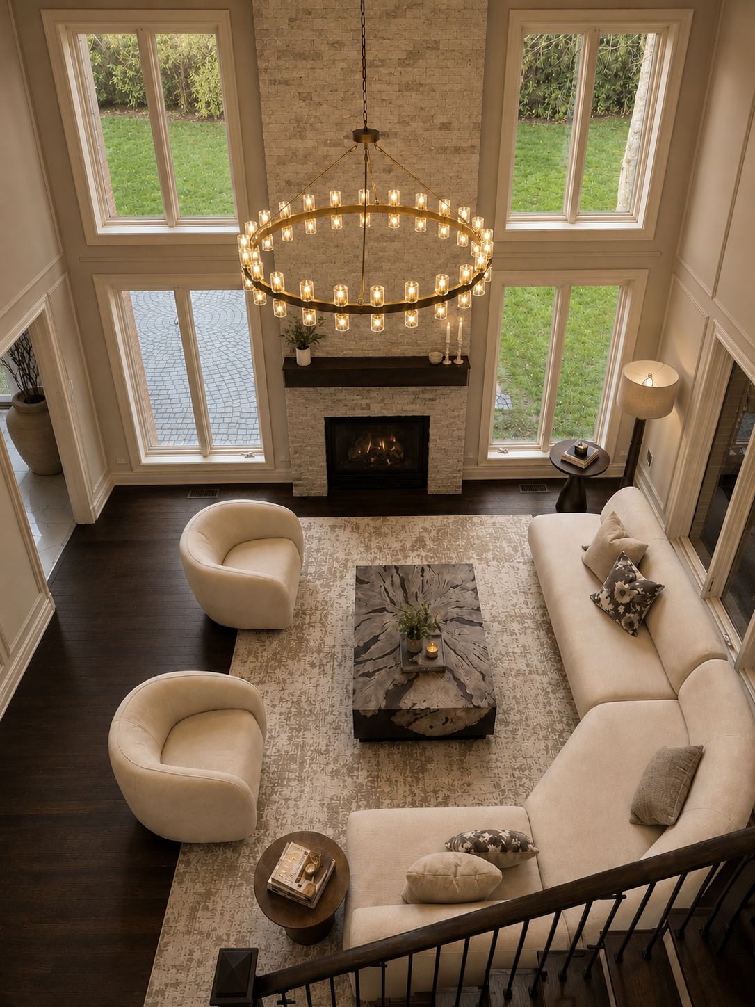 Living room with vaulted ceilings and brass ring chandelier